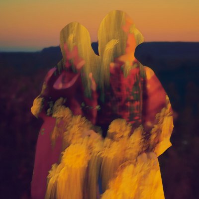 Two women in the field at sunset 1