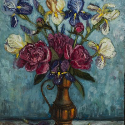 peonies and irises in a copper jug.