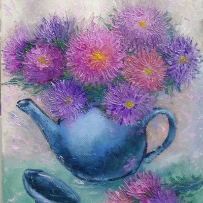 Flowers in a blue teapot