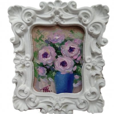 A bouquet of pink flowers in a frame