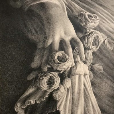 A woman's hand holding the hem