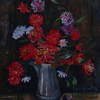 Red dahlias in a teapot