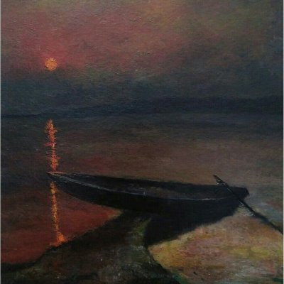 Boat in the background of a red sunset